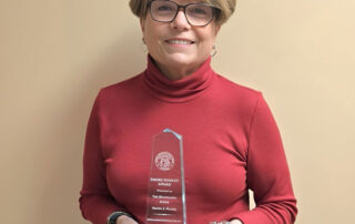 Judge Brenda Weaver holding the Emory Findley Award