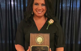 photo of Gilmer County Clerk of Superior Court Amy E. Johnson holding award
